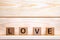 Love made of wood background. Love concept. Love sign, emotions concept. Word love made of wood blocks. Word Love