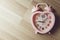 Love memory heart clock on wood background