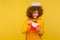 Love message. Portrait of happy curly-haired angelic woman with saint nimbus holding letter in envelope