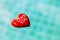 Love message on red heart floating on swimming pool water