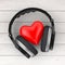 Love Music Concept. Black Wireless Headphones and a Red Heart. 3