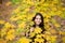 In love with nature. cheerful girl with yellow maple leaves. happy kid enjoy fall weather. small girl in autumn leaves