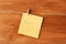 Love note on the pin on wooden background