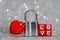 Love padlock against a silver-toned glittery background