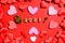 Love padlock on a red background with hearts for Valentine`s Day in 2021