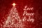 Love, peace and joy text on red background with shining star like pine tree. Christmas season concept.