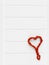 Love red pedig rattan heart on wooden light background