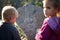 Love and relation concept, little boy and girl are looking on the message on the stone