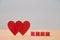 Love and relationship. Valentines Day. Couple in love. Amour, fondness. Two red hearts, wooden cubes mockup, copy space