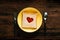 Love and Romance Concept. Bread on Plate with Spoon and Fork in Breakfast Time. Heart Shape with Tomato Sauce on Bread