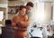 Love, romance and fun couple hugging, cooking in a kitchen and sharing an intimate moment. Romantic boyfriend and
