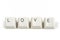 Love from scattered keyboard keys on white