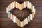 Love science concept. Books stacked in heart shape and molecule model on wooden desk. Take a degree in natural Sciences