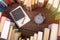 Love science concept. Heart shape of books, graduate cap and clock on wooden desk. Time to take a degree in natural Sciences