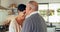 Love, senior couple and kiss on forehead in home, happy and bonding together for romance. Smile, elderly man and