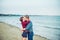 Love story on the sea. Honeymoon. Kiss. Couple in love having happy romantic tender moments on the beach. Boyfriend and girlfriend