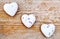 Love symbol - hearts on wooden background