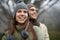 They love taking in the mountain views. A happy young couple enjoying the sights while hiking through the mountain.