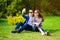 Love, technology, relationship, family and people concept - happy smiling young couple taking selfie in summer park.