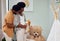 Love, teddy bear and pregnant couple in the nursery with excitement while preparing for their baby. Happy, pregnancy and