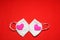 love in times of pandemic and covid, kn95 protection mask with hearts on red background, Valentine`s day