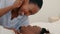 Love, touching and bedroom intimacy with funny black couple being playful and affectionate while laughing and bonding at