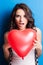 Love and valentines day woman holding heart smiling cute and ado