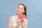 Love and valentines day woman holding heart smiling cute and adorable isolated on blue background