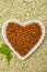 Love vegan and vegetarian food concept, plant based minced meat in heart shaped plate on soya beans background