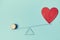 Love vs money mockup template. Blank red heart, coins on scales, copy space. Price of love. Isolated on blue background