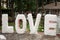 Love white letters . Outdoor decor photo. Love standing letters for wedding photography