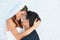 Love, woman and man embrace at wedding with smile, touch and commitment for couple at reception. Romance, bride and