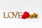 Love wooden font and red heart with yellow truck on white background