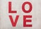 Love, wooden red letters