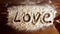 Love word and the heart on flour