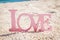 Love word on natural tropical background