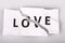 love word on torn paper - broken love concept