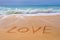 Love written on the sand of a beach, Valentines day