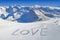 Love written in the snow, mountain landscape