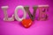 Love, written, text on pink background, valentins day