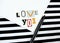 Love you - cut paper letter ,  declaration of love, combination of red black white colors, striped background