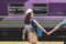 In love young Asian woman holding boyfriend hands follow her at train station. Romantic and travel in summer vacation concept