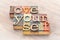 Love yourself word abstract in wood type