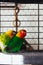 Lovebirds in a cage. Yellow and green birds in love. Nerosier Agapornis parrots.