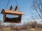 Lovebirds on top of bird feeder