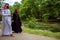 Lovely arabian couple in traditional clothes embracing outdoors