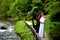 Lovely arabian couple in traditional clothes embracing outdoors