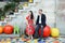 Lovely Asian couple holding hand and sitting on colorful art chairs