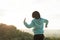 Lovely asian woman stretching on the blue sky background. Moment of relaxing and recreating