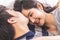 Lovely attractive young Asian couple man kiss forehead of happy woman with and hug in romantic moment. Warm heart marriage and lov